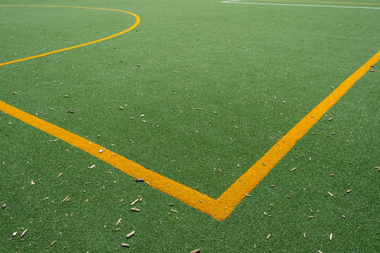 Yellow Line Markings on Green Artificial Turf Sports Field