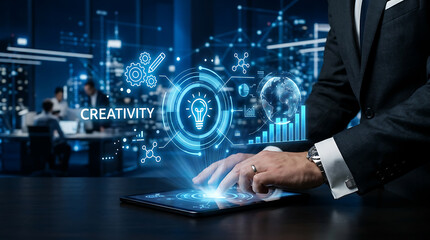 Fototapeta premium Businessman interacting with digital tablet displaying illuminated lightbulb and data visualizations