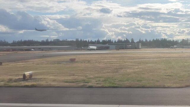 Airplane landing on airport runway in Washington state