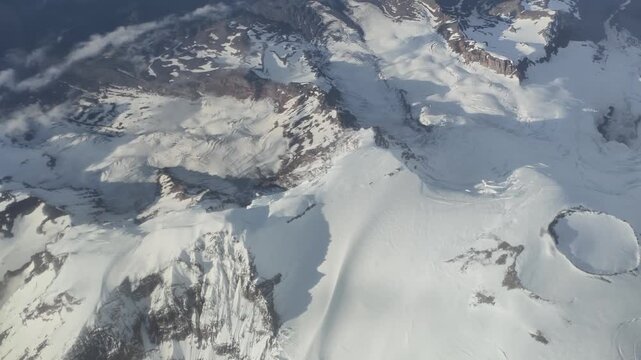 Aerial view of snow-covered mountain peaks and glaciers in Washington state
