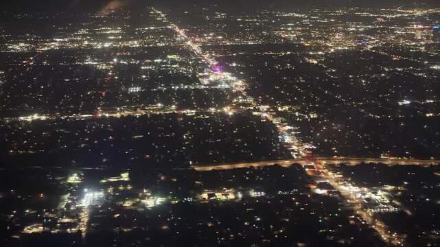 Aerial night view of Oklahoma City lights and highways