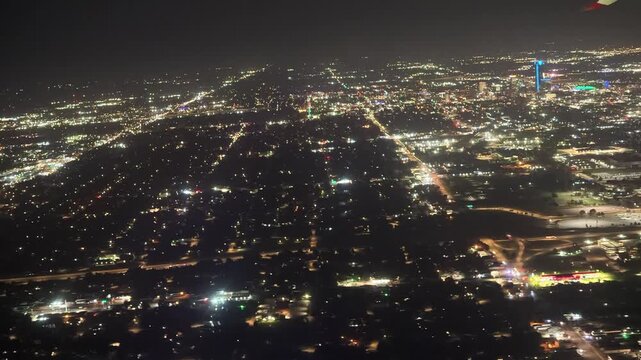 Aerial night view of Oklahoma City skyline and suburbs