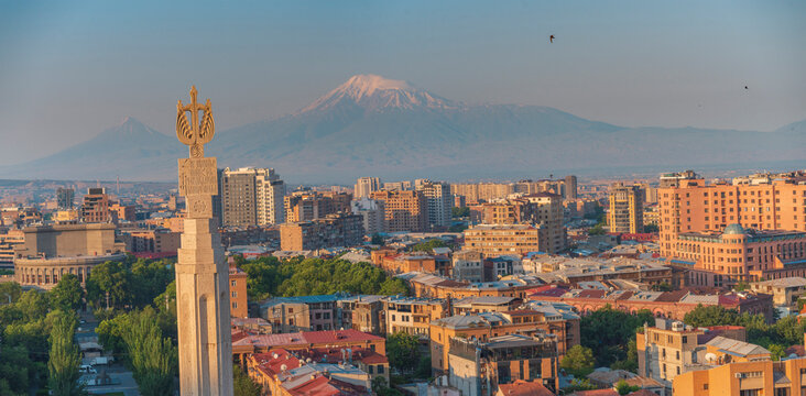 Yerevan panorama with Revived Armenia monument and mount Ararat at sunset with copy space