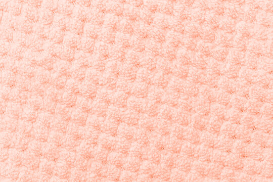 Soft coral textured fabric surface