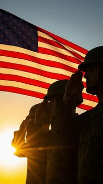 Silhouetted male soldiers saluting American flag at sunset representing patriotism honor and military service for memorial day
