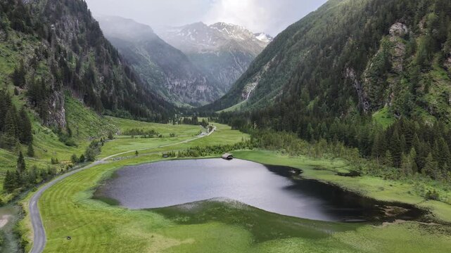 Mallnitz, Austria - June 11 2026: Beautiful 4K aerial drone footage of Stappitzer See, a picturesque alpine lake located in Hohe Tauern National Park, Carinthia, Austria. Stunning mountain scenery, cr