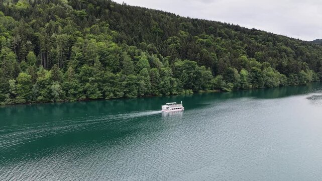 Millstatt, Austria - June 12 2026: Aerial Drone 4K Video of Boat Cruising on Millstatt Lake