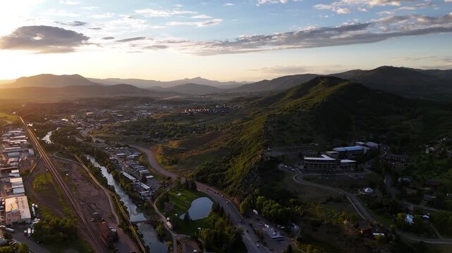 Drone Shot, Sunset Above Steamboat Springs and Hills in Summer Season, Colorado USA
