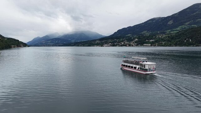 Millstatt, Austria - June 12 2026: Aerial Drone 4K Video of Boat Cruising on Millstatt Lake