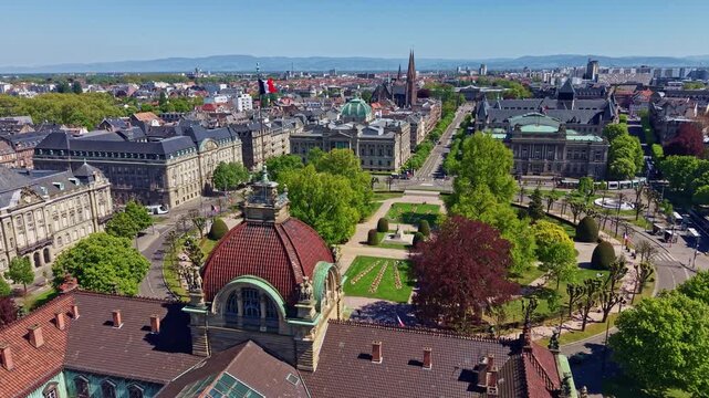 Distant drone fly over imperial Palais du Rhin to see Republic Square or Jardin de la Place de la R&eacute;publique with National University Library of Strasbourg and National Theatre, Strasbourg, France
