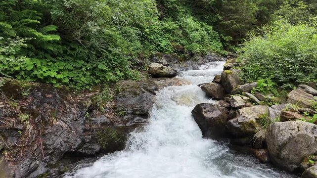 Flattach, Austria - June 12 2026: Raggaschlucht watterfalls and hiking trail. River Ragga. Drone footage. Drone flying over. Aerial footage. Following a bird flying over the river.