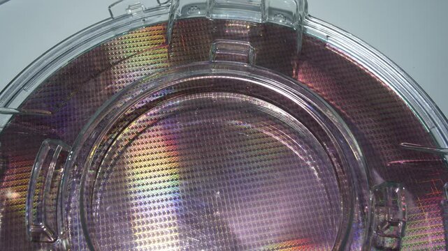 silicon wafers in a universal pod. Electronic circuit designs have been built onto the wafers using micromaching including photolithography