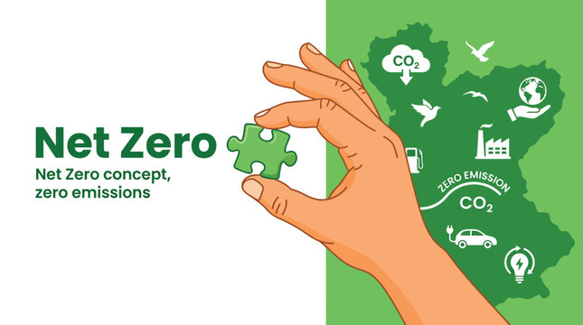 Hand holding a green puzzle piece representing the global movement toward achieving net zero emissions