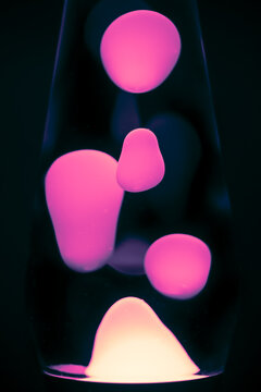 Neon Liquid Abstract Macro with Glowing Colorful Shapes on Black Background, vertical Format
