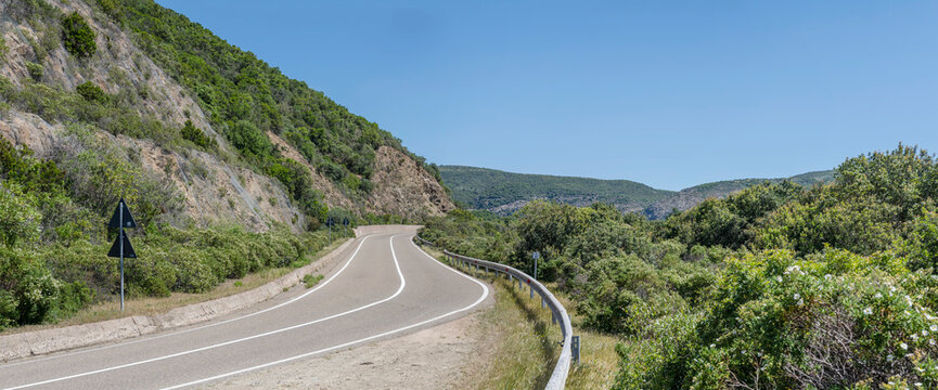 SS 126 bending road  in hilly countryside at Bidderdi pass, near Arbus,  Sulcis Iglesiente, Italy
