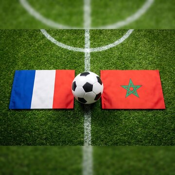 Soccer ball on green field with france and morocco flags for an international football match