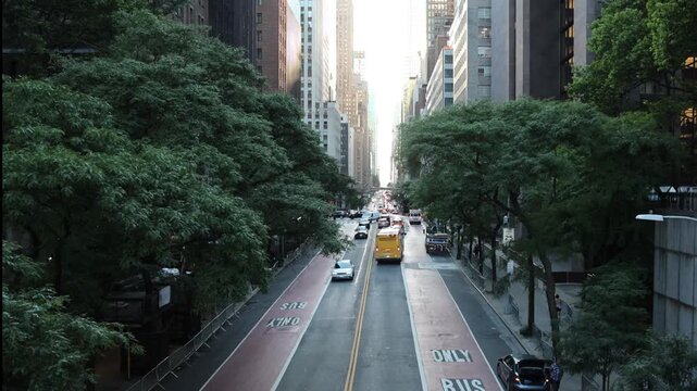 view down 42nd street in manhattan new york city skyline view (iconic skyscrapers) road cars drive sunset commercial business buildings center construction 2nd avenue travel tourism usa america famous
