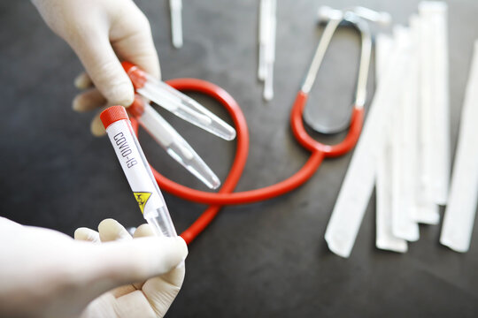 Medical background. PCR test for covid. Cotton swabs for taking a smear on the table.