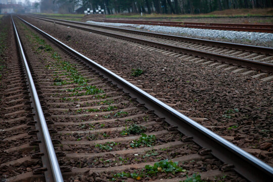 Parallel railway tracks in rural landscape