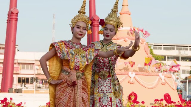 Traditional Thai Dancers Performing in Ornate Silk Costumes Outdoors