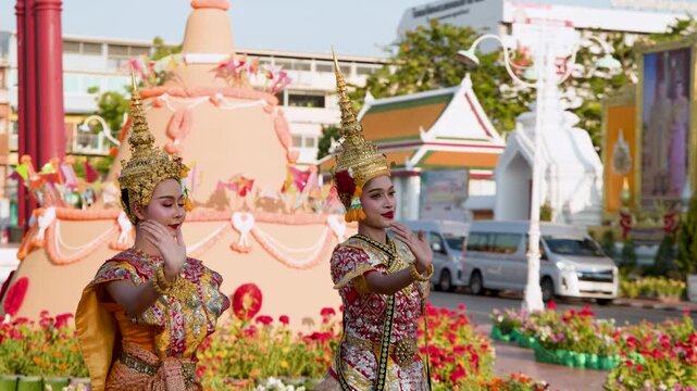Traditional Thai Dancers Performing in Ornate Costumes at Outdoor Festival