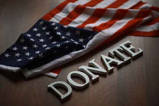 American Flag and Donate Text Symbolizing Patriotism, Charity, and Giving Back to Community
