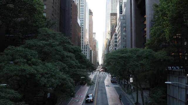 view down 42nd street in manhattan new york city skyline view (iconic skyscrapers) road cars drive sunset commercial business buildings center construction 2nd avenue travel tourism usa america famous