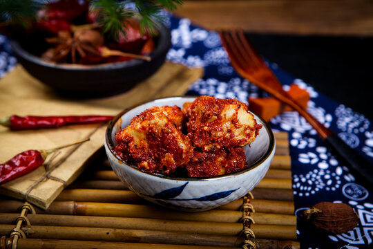 Chili Coated Fermented Tofu Cubes Paired With Chinese Tea And Dried Chilies