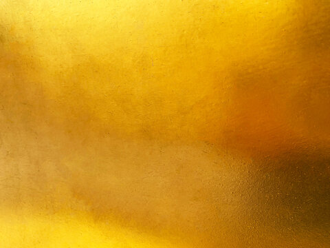 Gold metal background or texture  and gradients shadow horizontal shape, copy space (High resolution), real photo