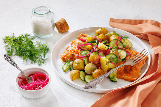 Baked salmon fillet, new potatoes, pickled onion