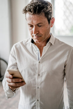 Businessman looking at cell phone