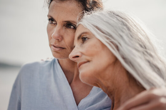 Mother and daughter spending a day at the sea, portrait