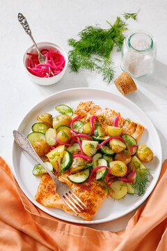 Baked salmon fillet, new potatoes, pickled onion