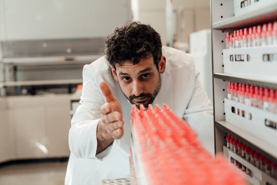 Scientist examining blood sample in laboratory