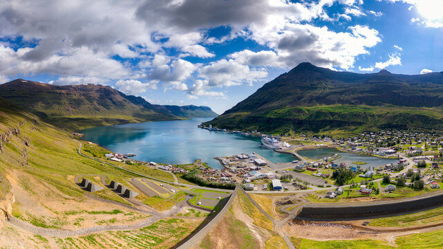 A panoramic view shows Sey�isfj�r�ur town in a lush Icelandic fjord