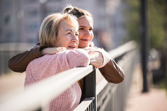 Granddaughter embracing her grandmother