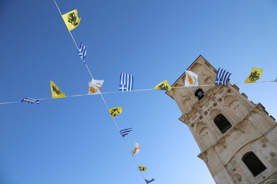 Festival Flags Crossing in Front of Historic Bell Tower