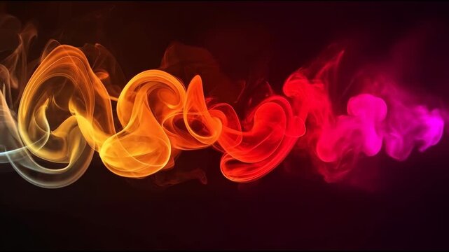 Colorful smoke ribbon flowing across black background with vibrant blue yellow orange ribbon swirl