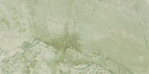 Elegant green marble texture with soft natural veins and warm earthy tones, perfect for luxury interiors, ceramic tiles, and decorative backgrounds. © Vidal