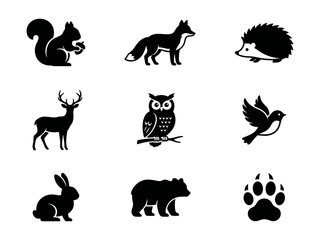 Obraz premium Set of black silhouette icons of wild forest animals and bird isolated on a simple design