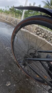 Close-up of Bicycle Wheel on Rural Road