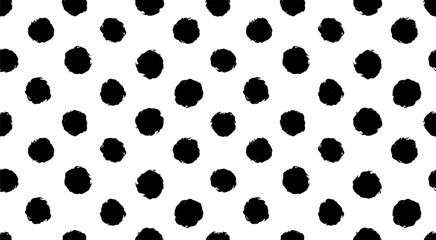 Fototapeta premium hand drawn bold oversized dots vector texture. small polka dot seamless pattern background.hand drawn black and white circle textile