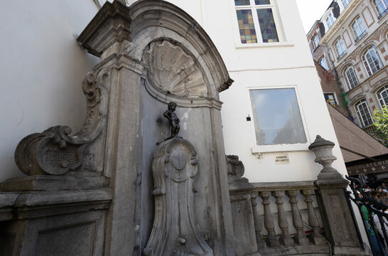 BRUSSELS, BELGIUM, JULY 13, 2025 - Manneken Pis, a famous bronze fountain statue located in the center of Brussels, depicting a child urinating, Belgium