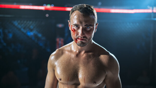 MMA Fighters End a Hard Fight Inside the Cage as a Bloodied Athlete Faces Forward,  Raw Contact Sport Moment Showing Pain, Grit, Endurance After a Competitive Fight for the Champion Title Belt.