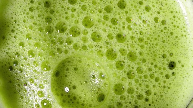 Top view close-up of green matcha tea foam antioxidant detox healthy drink


