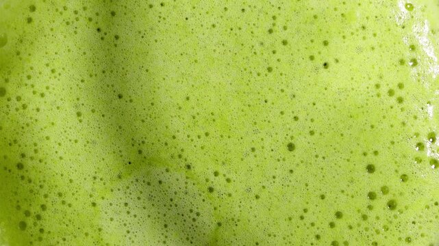Top view close-up of green matcha tea foam antioxidant detox healthy drink

