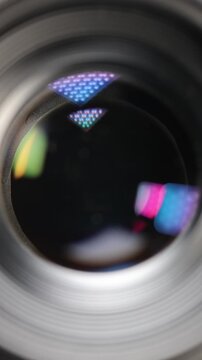 Close-up macro shot of a camera lens aperture smoothly closing from its widest to its narrowest setting, showcasing the precision of optical mechanics and exposure control