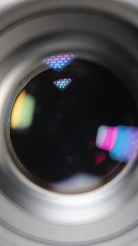 Close-up macro shot of a camera lens aperture smoothly closing from its widest to its narrowest setting, showcasing the precision of optical mechanics and exposure control