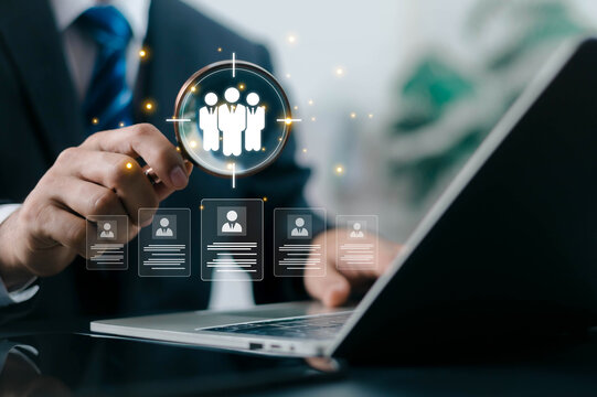 Business professional analyzing candidate profiles through digital recruitment platform for talent acquisition, HR management, employee selection, hiring process, and workforce planning.
