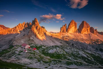 Three Peaks of Lavaredo, Dolomites, Italy. Amazing panorama of Italian  Dolomites with famous Three Peaks of Lavaredo (Tre Cime di Lavaredo) South Tyrol, Italy, Europe at summer sunset. © rudi1976